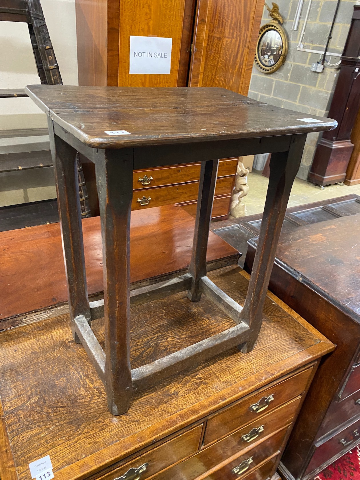 A small rectangular oak stool with chamfered supports, width 52cm, depth 42cm, height 66cm